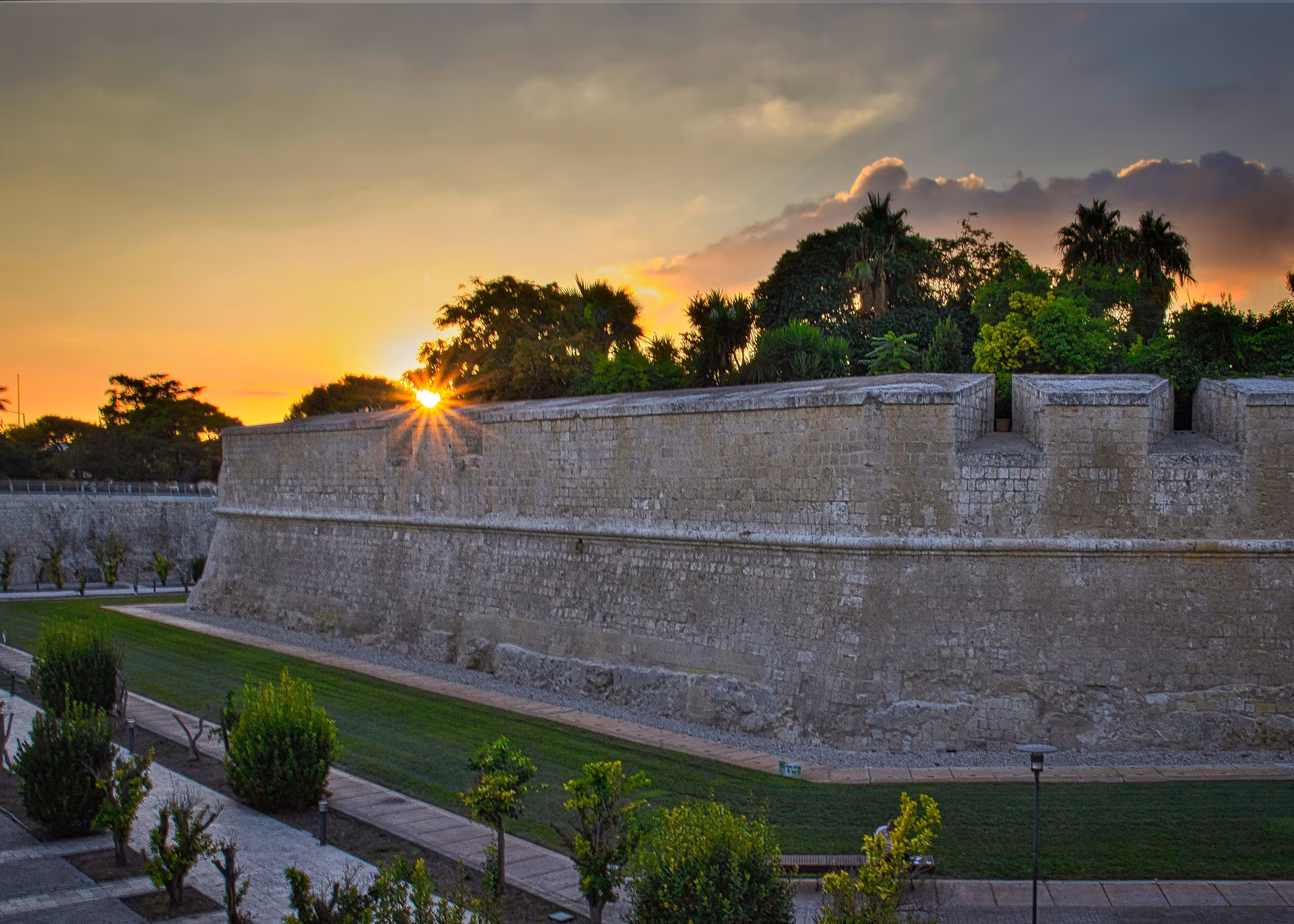 The bastion walls of Mdina glowing at sunset